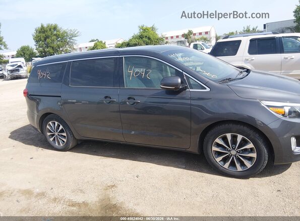 KNDMC5C1XG6171503 2016 KIA SEDONA Silver Widok wnętrza z tyłu