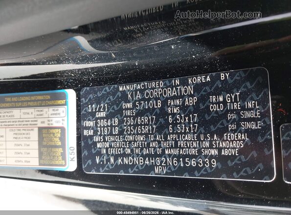 KNDNB4H32N6156339 2022 KIA CARNIVAL MPV Black Widok komory silnika