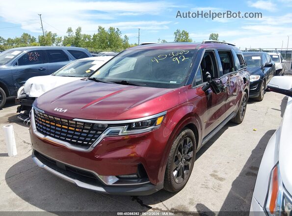 KNDNE5H32P6204034 2023 KIA CARNIVAL MPV Burgundy Vista tres cuartos delantera izquierda