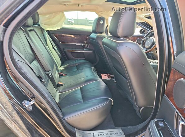 SAJWA1C75H8W10478 2017 JAGUAR XJ Black Rear seats view
