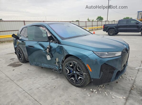 WB523CF03SCT49398 2025 BMW IX Синий Передняя правая четверть