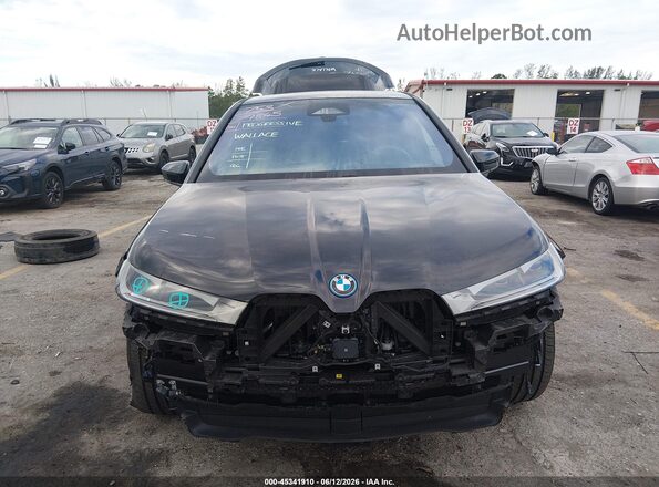 WB523CF06SCU18407 2025 BMW IX Black Rear interior view