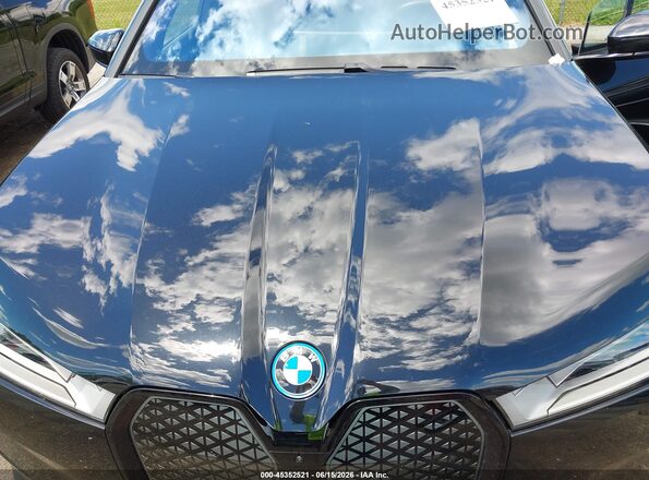 WB523CF07RCR91990 2024 BMW IX Black Rear view