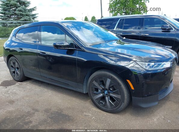 WB523CF07RCR91990 2024 BMW IX Black Rear interior view