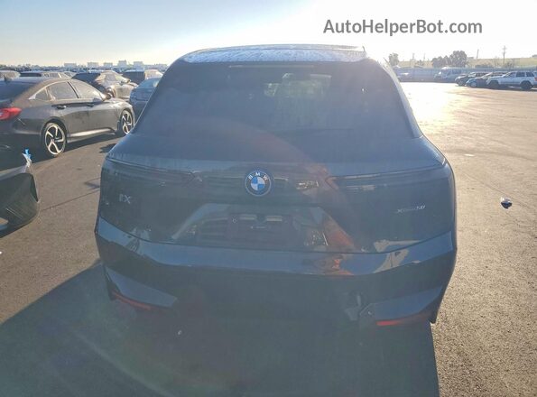 WB523CF07SCS50339 2025 BMW IX Black Rear view