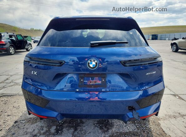 WB523CF08SCU58827 2025 BMW IX Синий Вид сзади