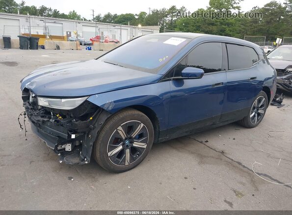WB523CF09RCN84740 2024 BMW IX Синий Передняя левая четверть