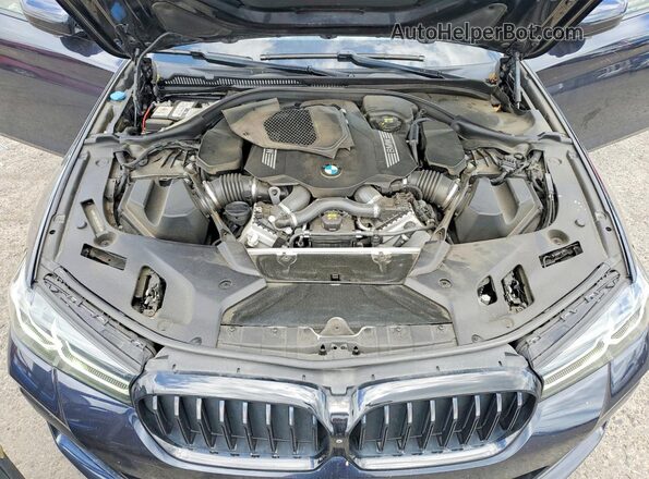 WBA13BK03MCG09740 2021 BMW M5 Blue Vista interior trasera