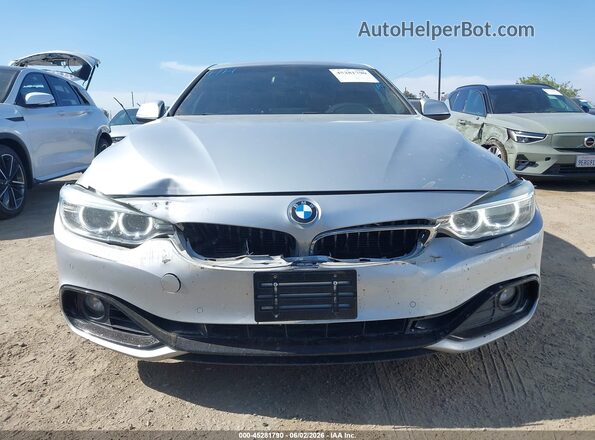 WBA4A9C5XGG505309 2016 BMW 7 SERIES Silver Widok z przodu