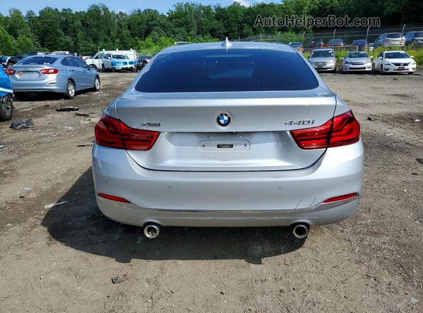 WBA4J7C5XJBH14836 2018 BMW OTHER Silver Rear view