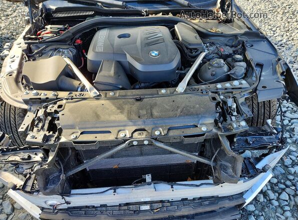 WBA53FJ01RCS51066 2024 BMW 5 SERIES Silver Вид задньої частини салону