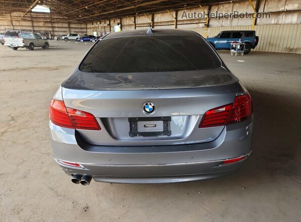 WBA5A5C56GG352439 2016 BMW 5 SERIES Gray Vista trasera