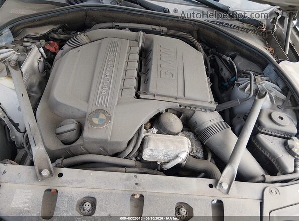 WBA5B3C51GG252590 2016 BMW 5 SERIES Gray Vista trasera