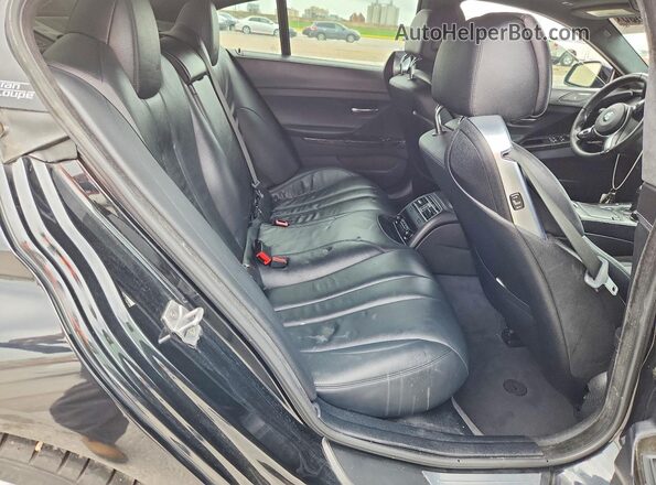 WBA6D0C55JG852842 2018 BMW OTHER Black Vista de los asientos traseros