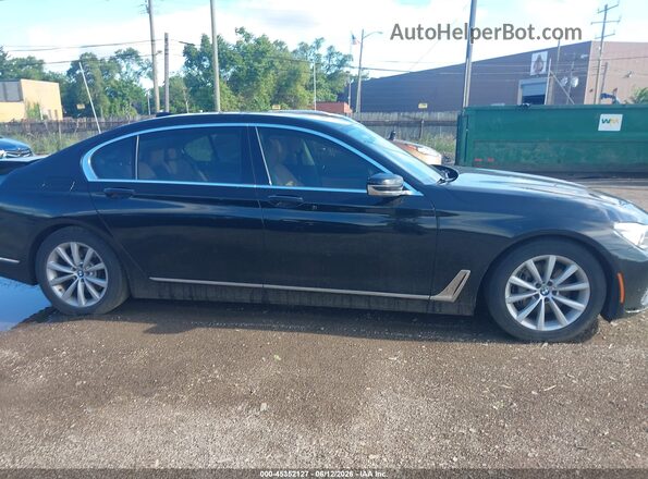WBA7E4C51KGV28409 2019 BMW 7 SERIES Черный Вид задней части салона