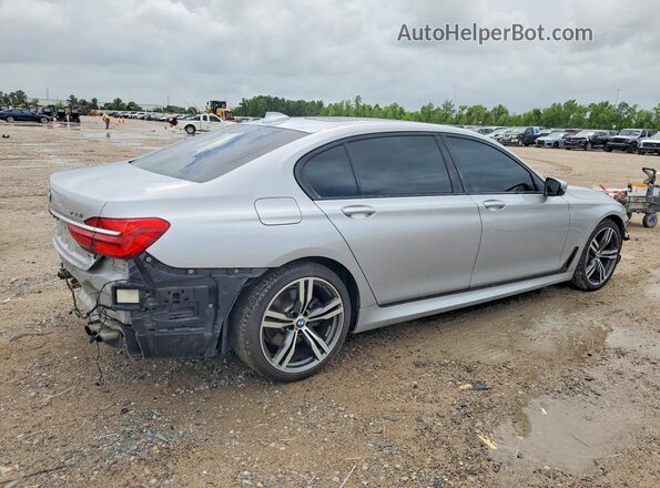 WBA7F0C33HGM21603 2017 BMW 7 SERIES Серебряный Задняя правая четверть