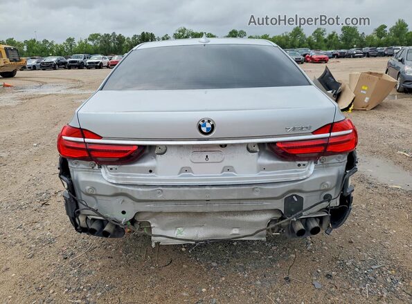 WBA7F0C33HGM21603 2017 BMW 7 SERIES Серебряный Вид сзади