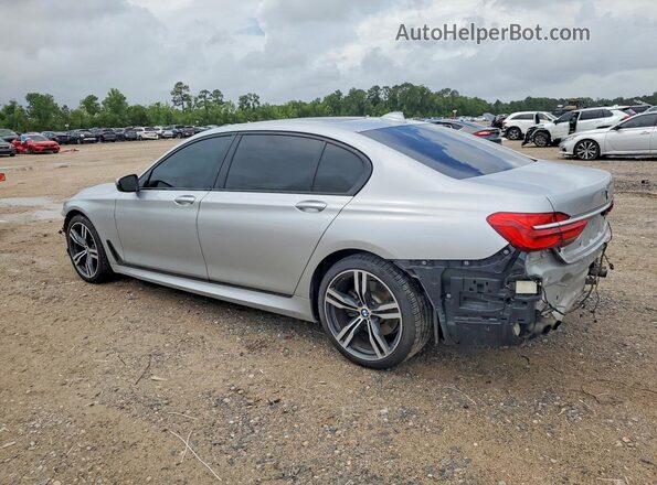 WBA7F0C33HGM21603 2017 BMW 7 SERIES Серебряный Задняя левая четверть