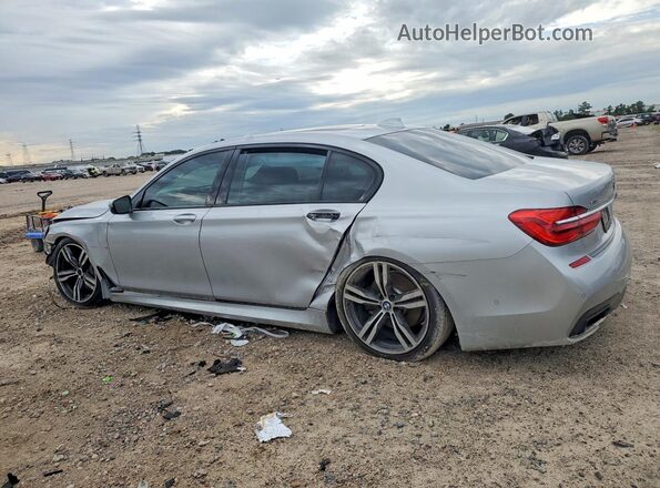 WBA7F2C57HG421875 2017 BMW 7 SERIES Silver Tył lewy