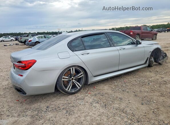 WBA7F2C57HG421875 2017 BMW 7 SERIES Silver Tył prawy