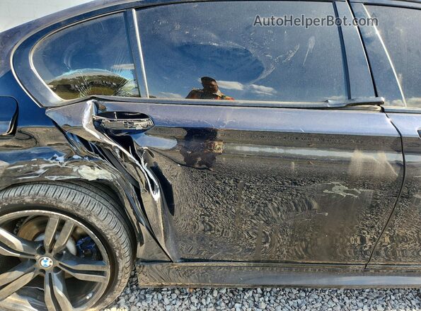 WBA7F2C58GG415971 2016 BMW 7 SERIES Black Vista de los asientos traseros