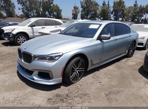 WBA7H6C52JG614930 2018 BMW M760I Серебряный Передняя левая четверть