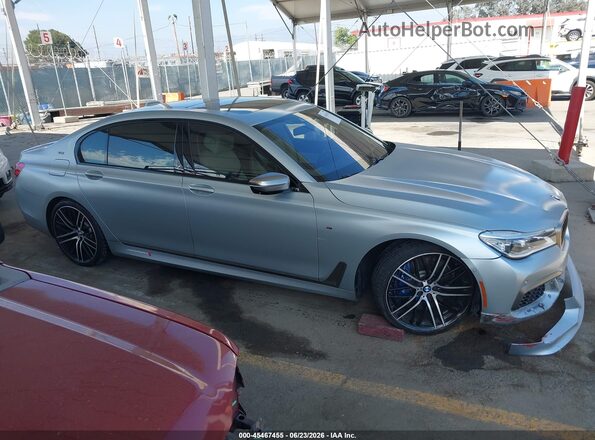WBA7H6C52JG614930 2018 BMW M760I Серебряный Вид задней части салона