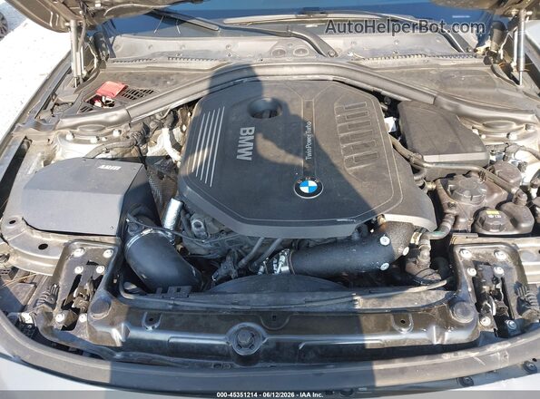 WBA8B7G59GNT70610 2016 BMW 3 SERIES Gray Rear view