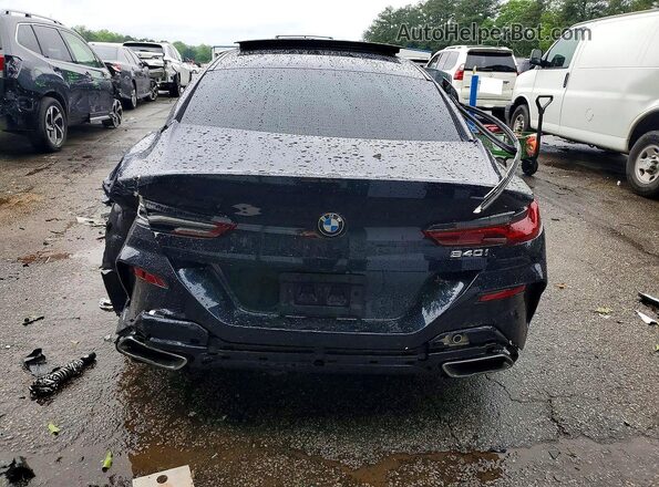 WBAGV2C06LCD87499 2020 BMW 8 SERIES Black Widok z tyłu