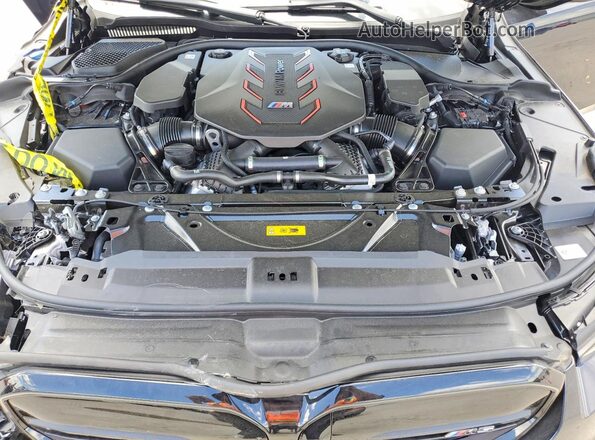 WBS83FK02TCW63513 2026 BMW M5 Charcoal Вид задньої частини салону
