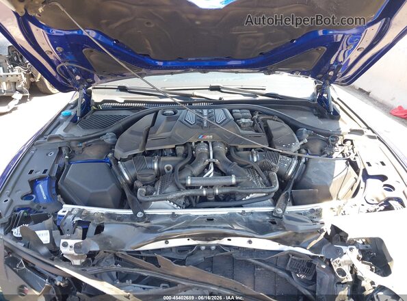WBSAE0C02PCM46038 2023 BMW M8 Blue Հետևի տեսք