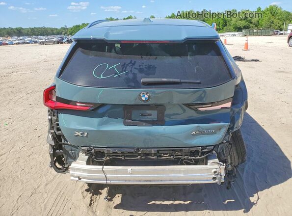 WBX73EF06R5Z74918 2024 BMW X1 Teal Rear view