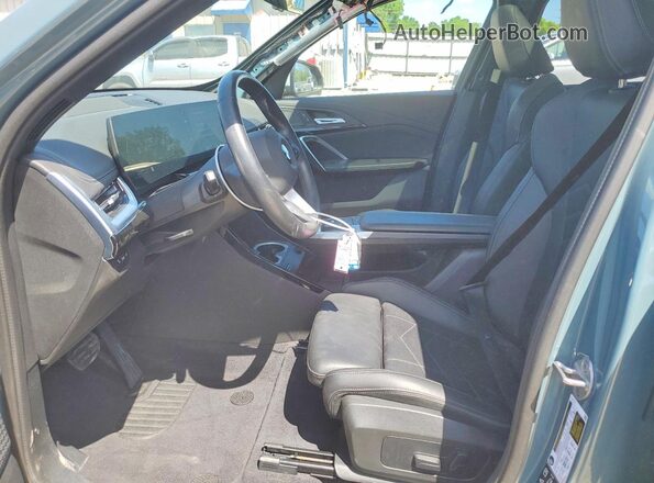 WBX73EF06R5Z74918 2024 BMW X1 Teal Front interior view