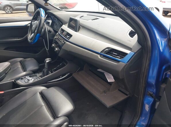 WBXHT3C30G5E48615 2016 BMW X1 Blue წინა სალონის ხედი