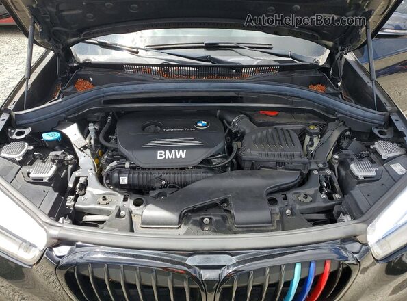 WBXHT3C30H5F83790 2017 BMW X1 Black Սալոնի հետևի տեսք