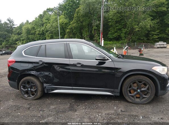 WBXHT3C30J5L29886 2018 BMW X1 Black Widok wnętrza z tyłu