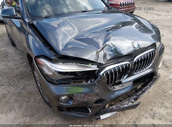 WBXHT3C31GP883323 2016 BMW X1 Gray Front view