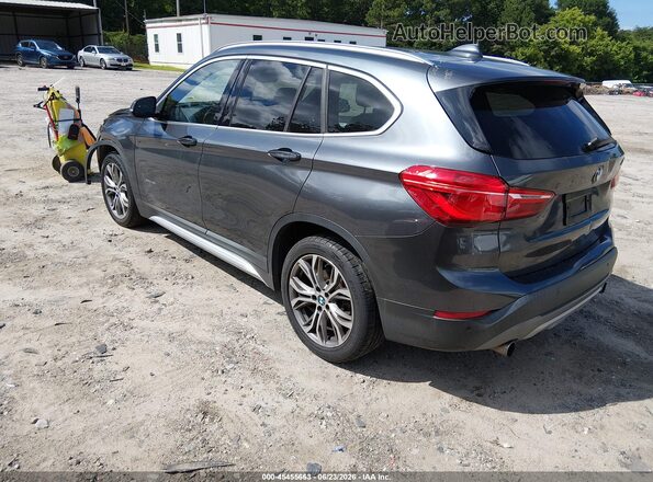 WBXHT3C31GP883323 2016 BMW X1 Gray Rear left
