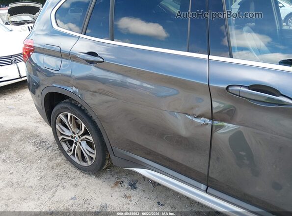 WBXHT3C31GP883323 2016 BMW X1 Gray 