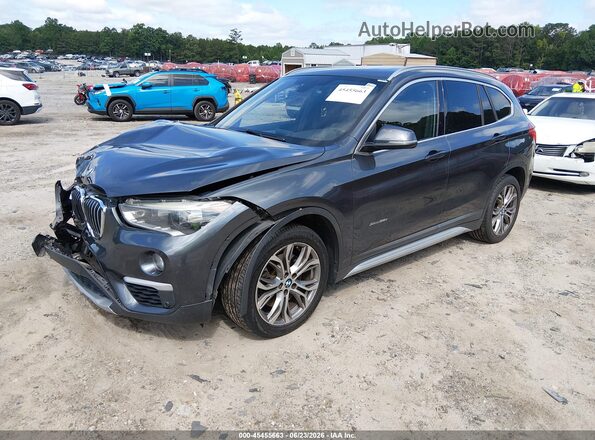 WBXHT3C31GP883323 2016 BMW X1 Gray Front left