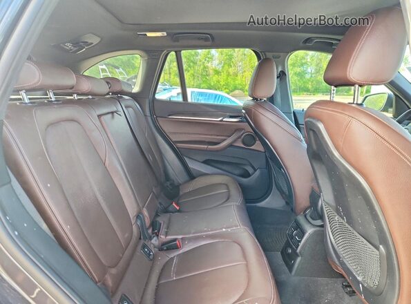 WBXHT3C32G5E53881 2016 BMW X1 Gray Սալոնի հետևի տեսք