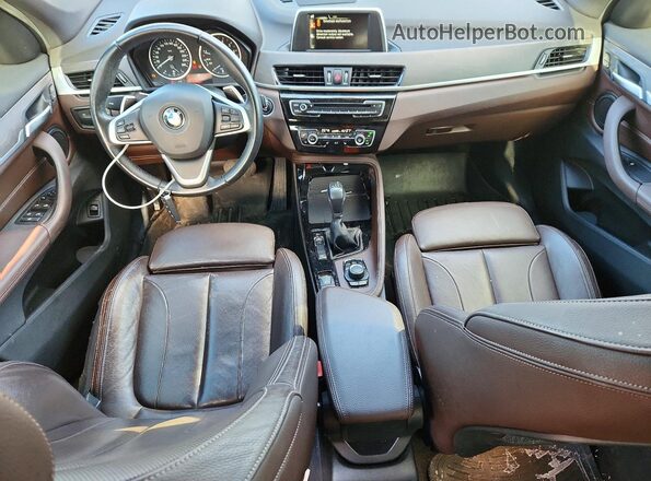 WBXHT3C32G5E53881 2016 BMW X1 Gray Առջևի վահանակի տեսք