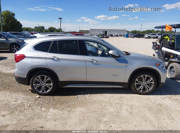 WBXHT3C32H5F74296 2017 BMW X1 Silver Вид задньої частини салону
