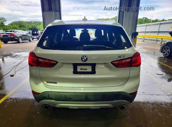 WBXHT3C32H5F78977 2017 BMW X1 White Rear view