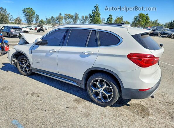WBXHT3C33G5E55946 2016 BMW X1 White Rear left
