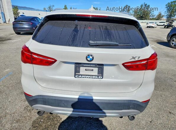 WBXHT3C33G5E55946 2016 BMW X1 White Rear view
