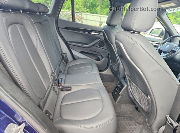 WBXHT3C33GP880665 2016 BMW X1 Blue Rear interior view