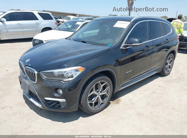 WBXHT3C33H5F81581 2017 BMW X1 Black Przód lewy