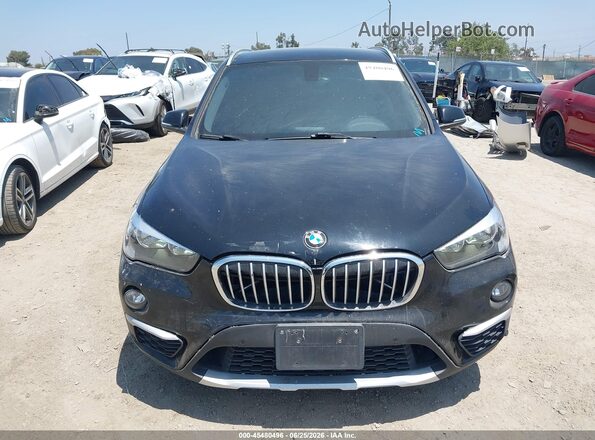 WBXHT3C33H5F81581 2017 BMW X1 Black Widok wnętrza z tyłu