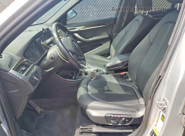 WBXHT3C34G5E52411 2016 BMW X1 Silver Front interior view